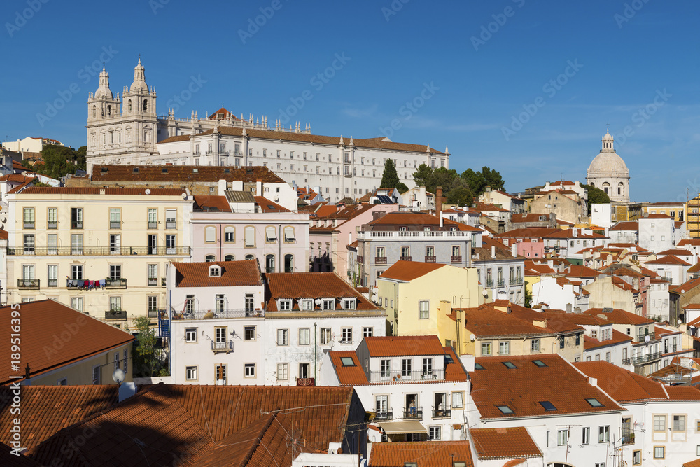 View of the Alfama neighborhood from the Portas do Sol viewpoint in Lisbon, Portugal; Concept for travel in Portugal, visit Lisbon and most beutiful places in Portugal
