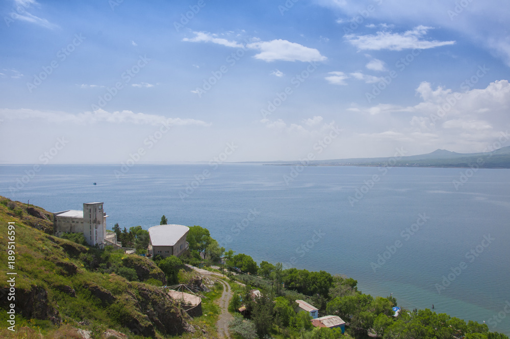View of the largest source in the entire Caucasus - Lake Sevan. Blue sky and horizon line. Gegharkunik, Armenia.