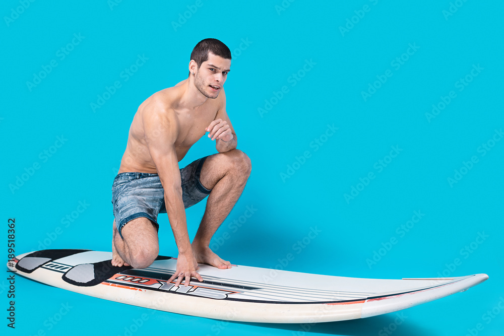 Surfer riding waves