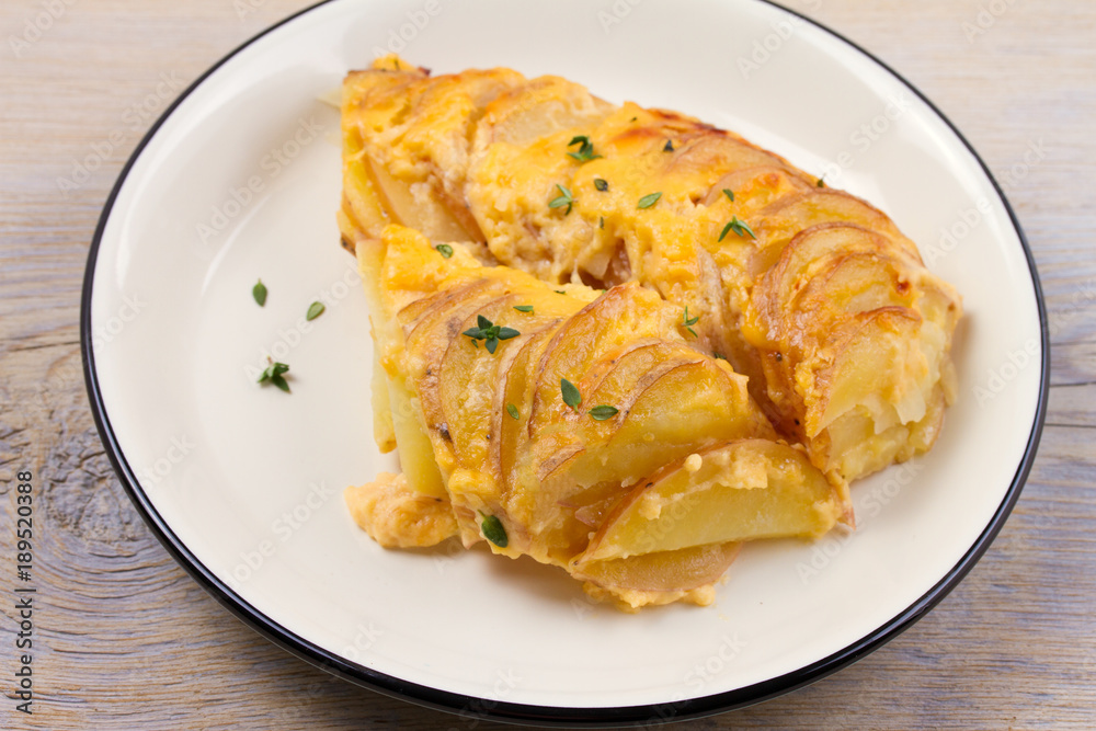 Potato gratin. Baked potato slices with creamy sauce. horizontal Potato gratin. Baked potato slices with creamy sauce. horizontal