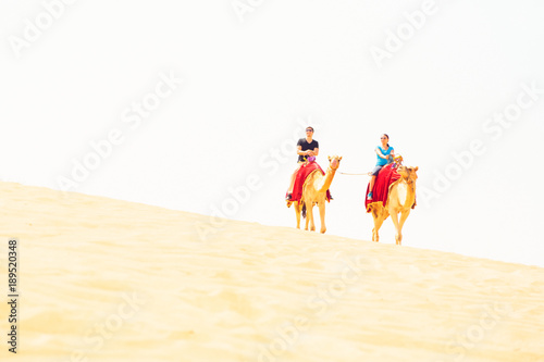 Tourists Riding Through The Desert