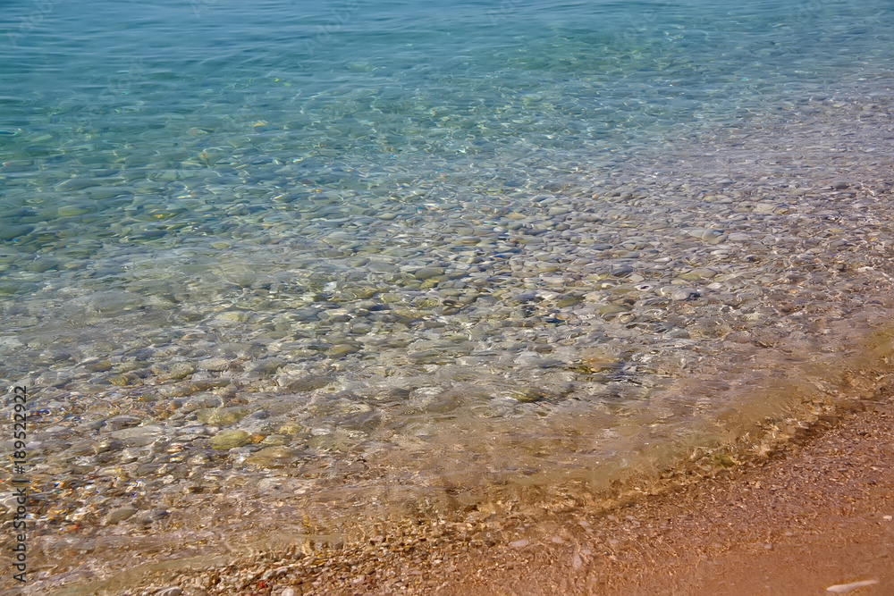 Seawater with a stones and sand