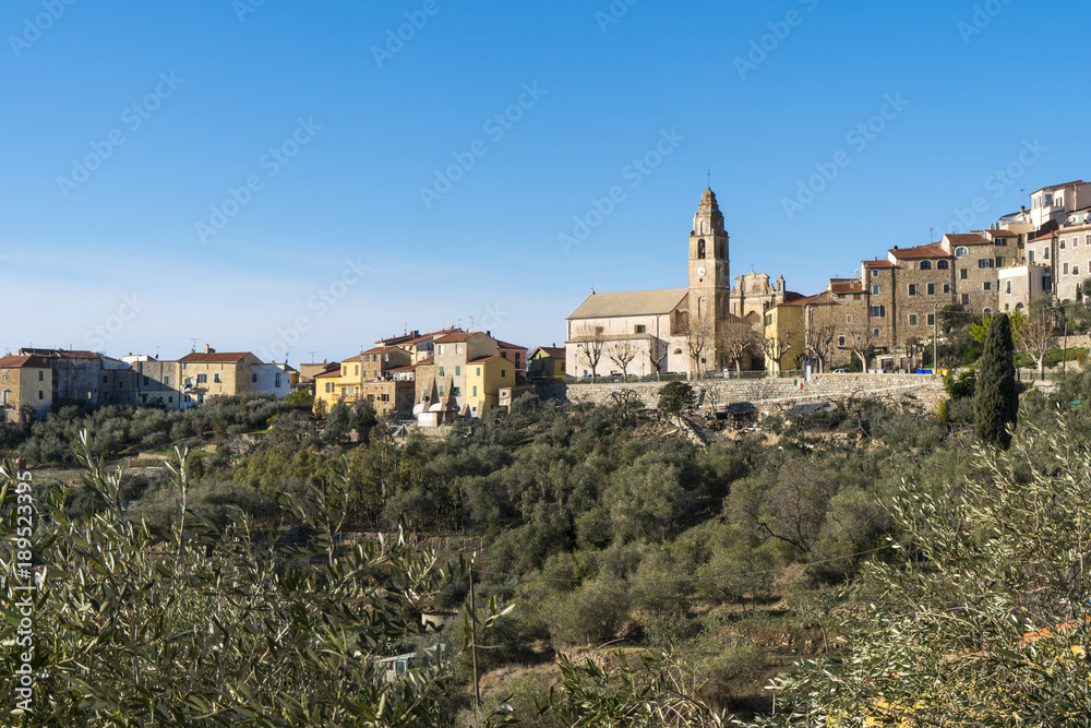 Panorama of the small town of Cipressa (Liguria, Italy), surrounded by olive trees cultivation. Typical Italian country village overlooking the Mediterranean sea, Ligurian Riviera.