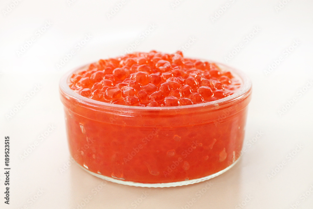 Glass bowl with red salmon caviar. Traditional Russian food. Glass bowl with red salmon caviar. Traditional Russian food.