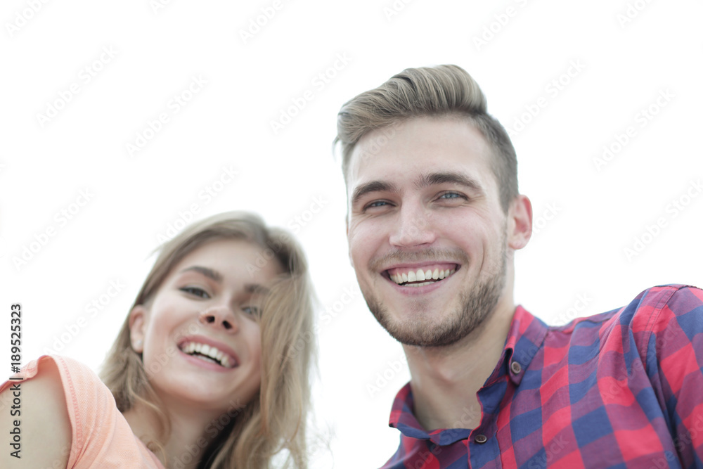closeup of three young people smiling on white background closeup of three young people smiling on white background