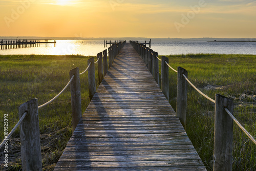 Wooden Dock and Ocean at Sunset