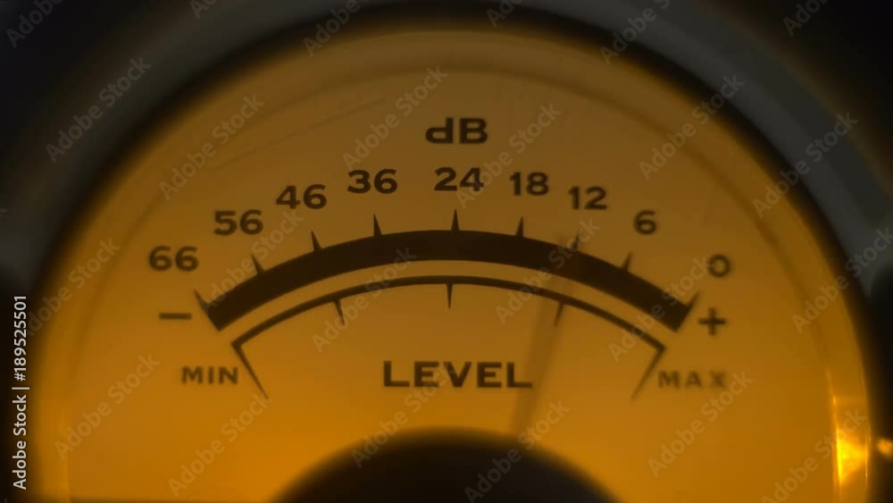Close-up of classic analoge volume indicator working Reel to reel VU meters on sound mixer. Volume indicator needles moving from music sound. Professional studio equipment Close-up of classic analoge volume indicator working Reel to reel VU meters on sound mixer. Volume indicator needles moving from music sound. Professional studio equipment