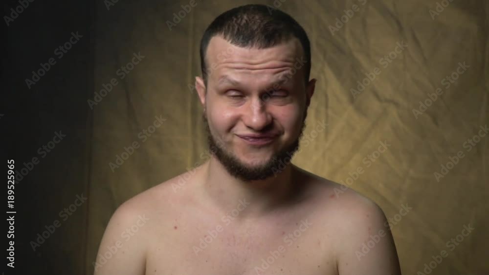 The man grimaces and shows a contemptuous refusal