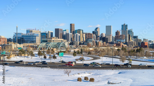 Winter at Downtown Denver - A winter panoramic view of Denver skyline and its busy street and highway I-25 after a snow storm. Colorado, USA.