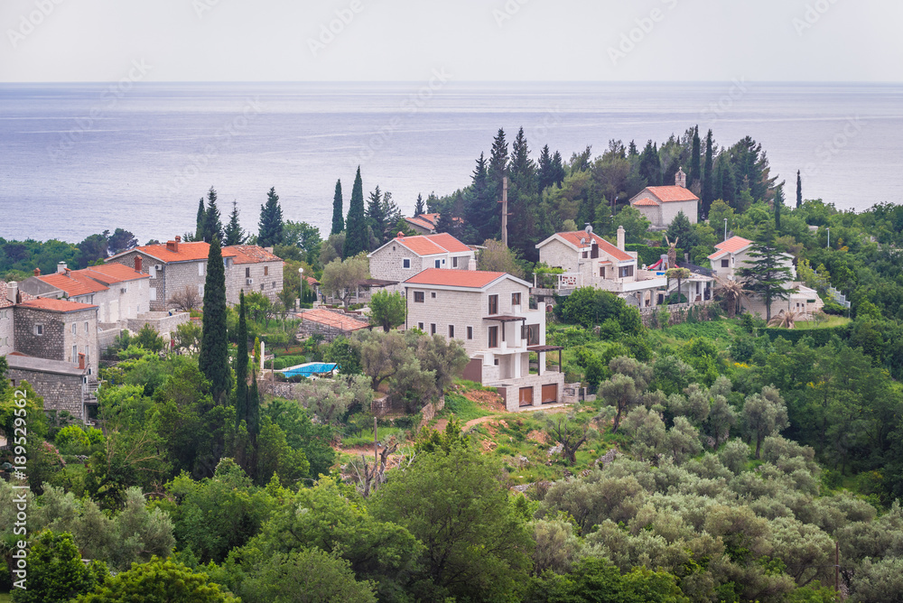Residential buildings on Adriatic Sea shore in so called Budva Riviera, Montenegro