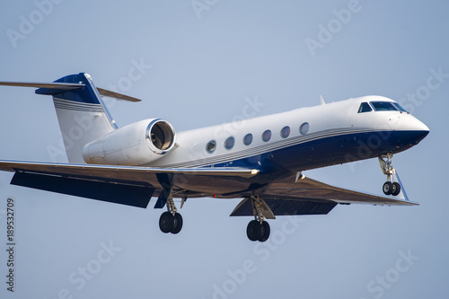 Small private business jet landing at the airport