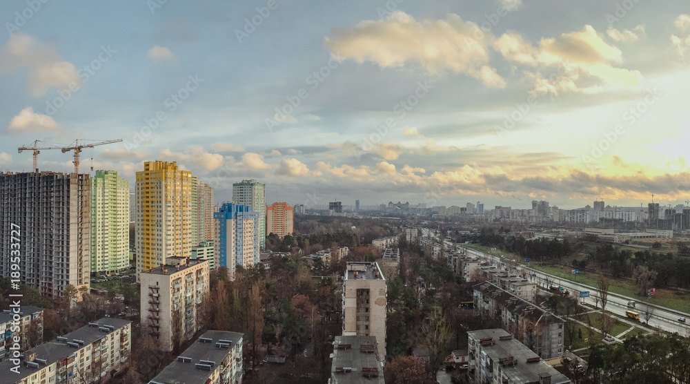 cityscape of Kiev with new and old buildings in spring. Mobile photo