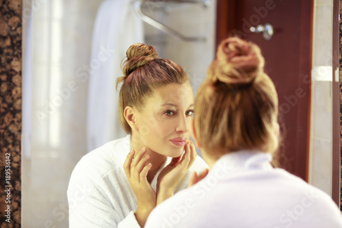 Magic anti-aging cream.Applying the cream