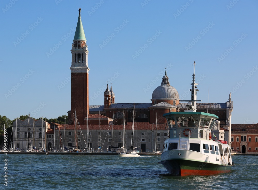 church of San Giorgio in Venice and a water bus to tourists transport in the Italian city