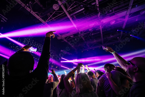 dj night club party rave with crowd in music festive