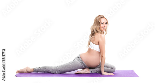 Portrait Of Pregnant Woman Doing Yoga