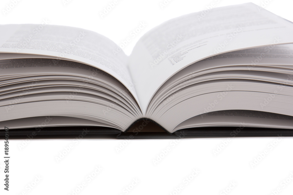 large opened hardcover book on white background large opened hardcover book on white background