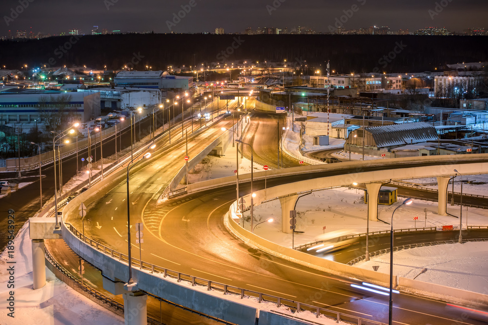 Night scenic view on road junction and bridge at Moscow district. Russia.