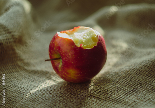 bitted apple on the saking background. fruit, natural food