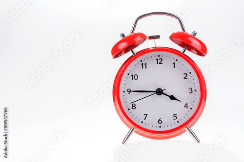 Old red retro alarm clock isolated on white, Time concept