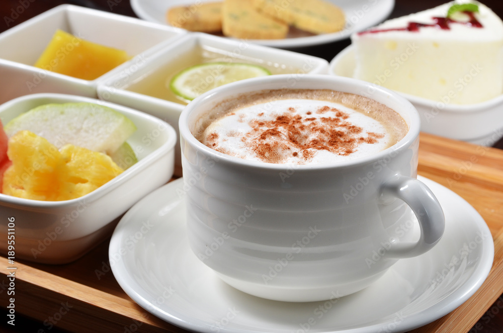 Cup of coffee with dessert, fruit on the table Cup of coffee with dessert, fruit on the table