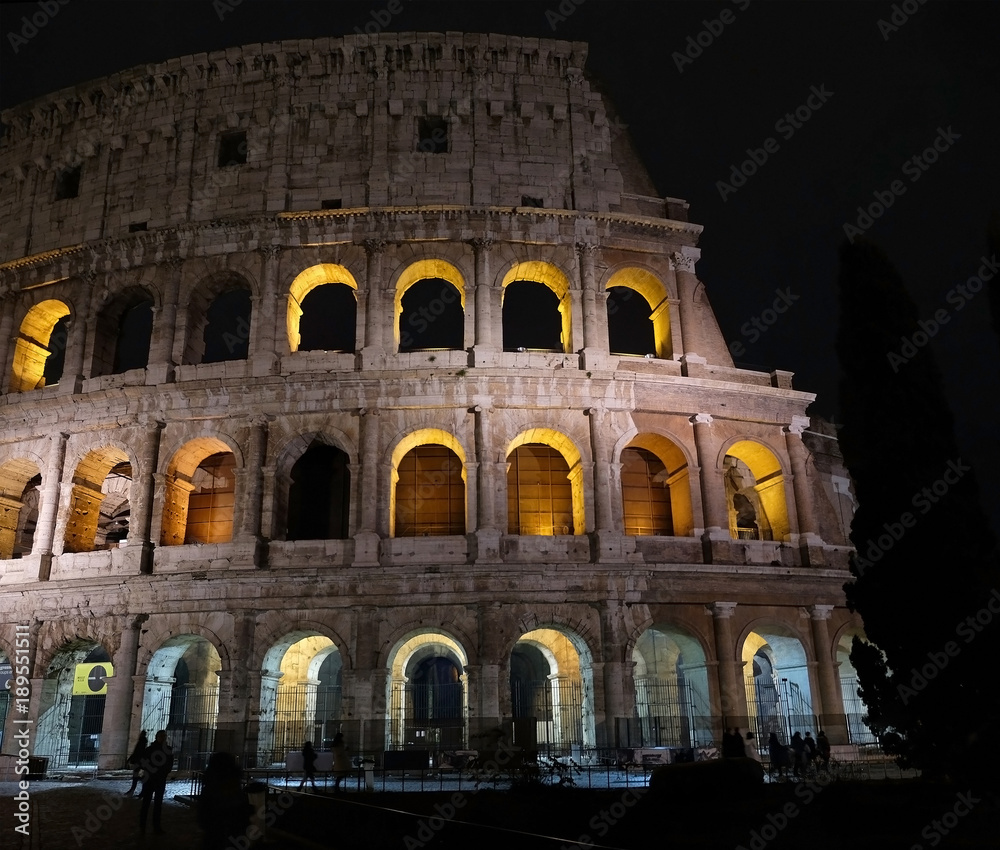Ancient amphitheater Colosseum in the night