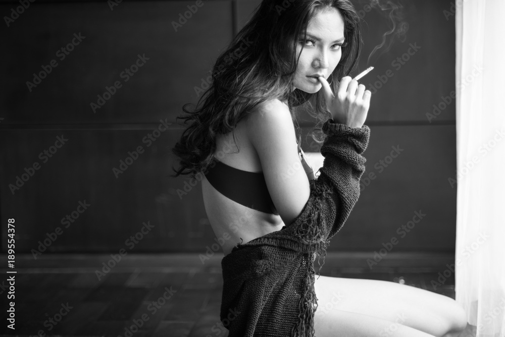 sexy asian woman and cigarette on black lingerie in room Stock Photo |  Adobe Stock