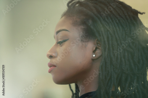 Canvas-taulu Thoughtful African girl with dreadlocks