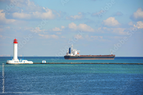 Bulk carrier near lighthouse