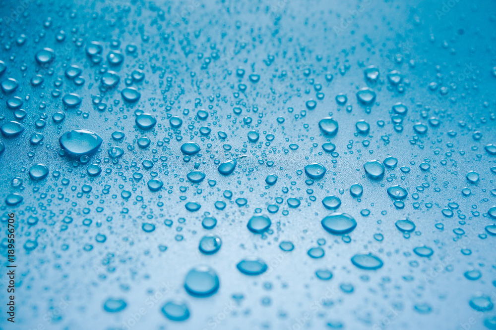 Water Drops On Blue Background.