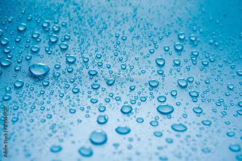 Water Drops On Blue Background.