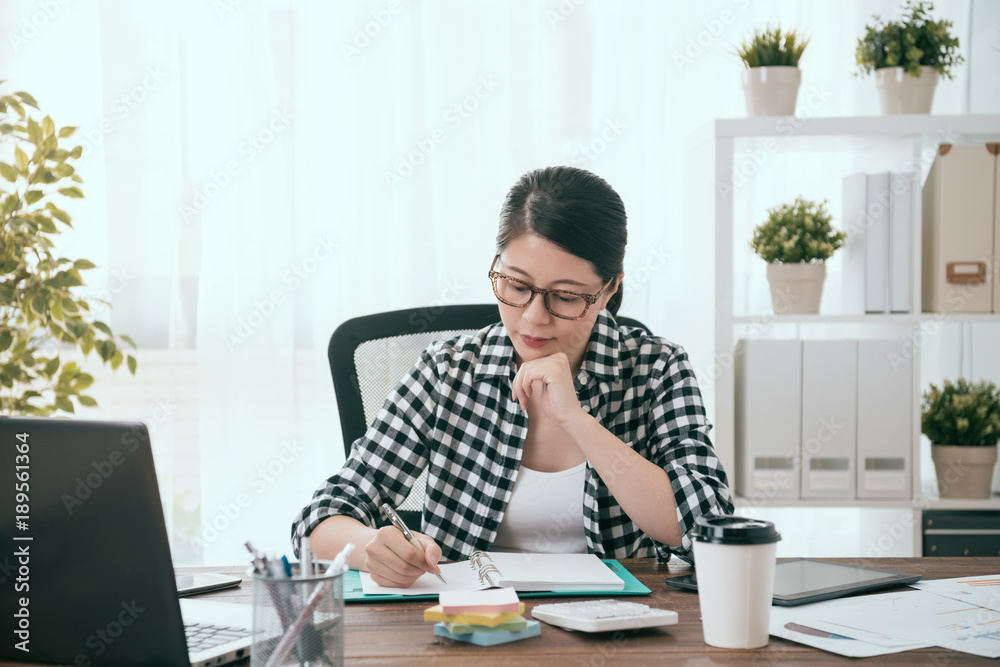 young lady business worker writing work schedule