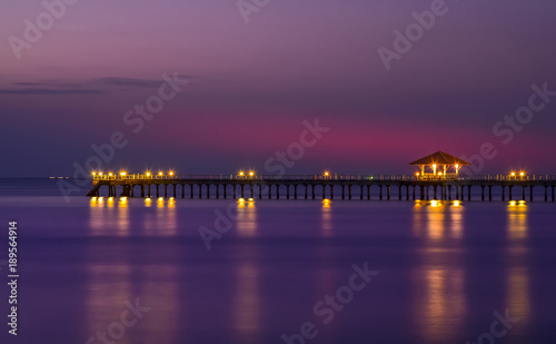 A long beautiful bridge with light of city at twilight time © APchanel
