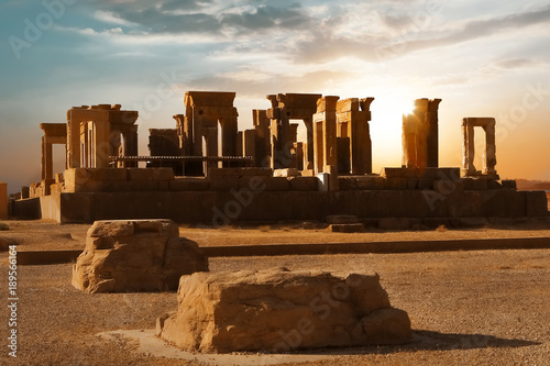 Sunrise in Persepolis, capital of the ancient Achaemenid kingdom. Ancient columns. Sight of Iran. Ancient Persia. Sunrise background. photo