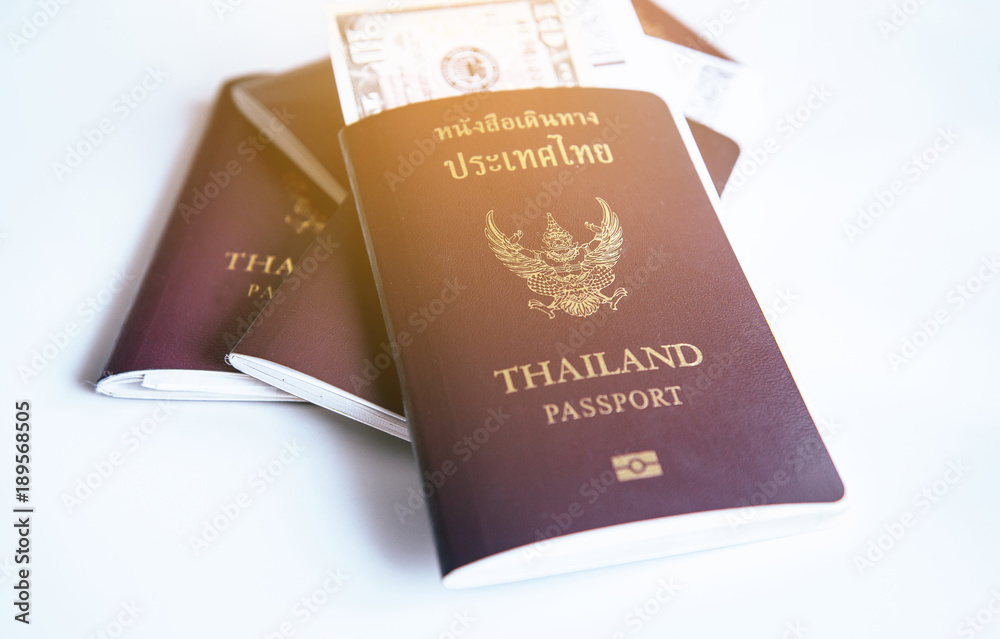 Passport with fight ticket on white table Passport with fight ticket on white table