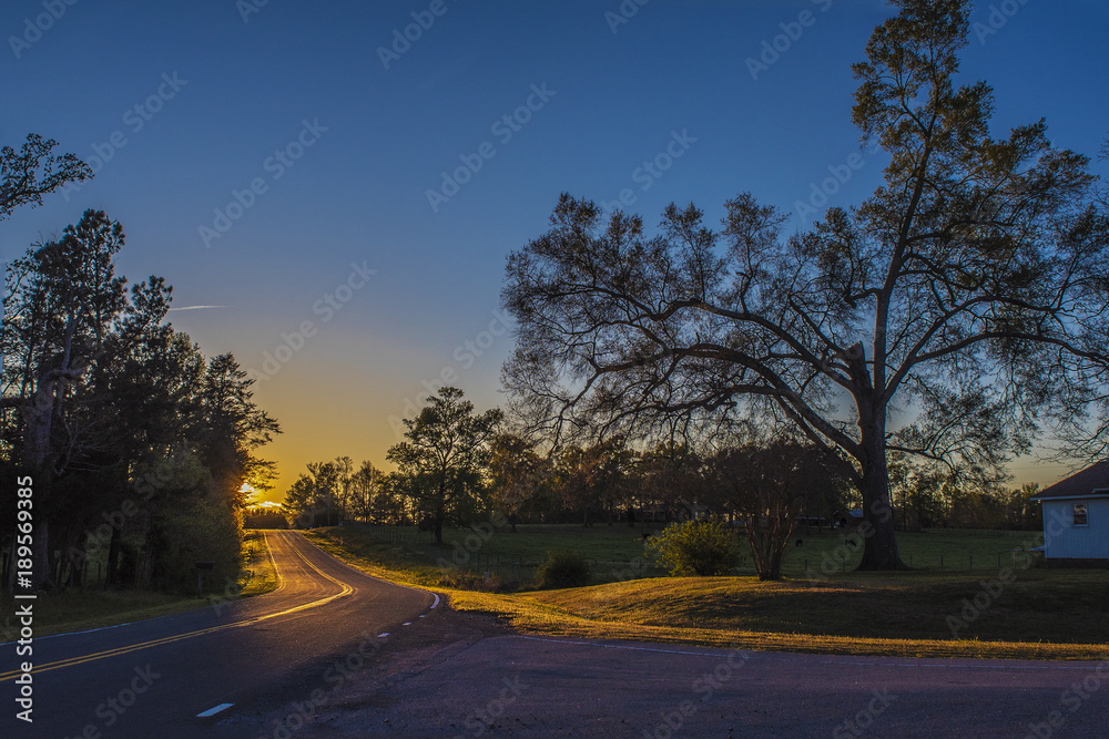 Sunset on the horizon of a road Sunset on the horizon of a road