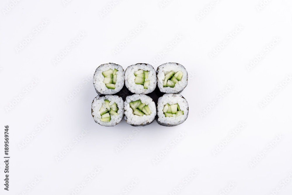 Classic mini sushi rolls with cucumber top view. Classic mini sushi rolls with cucumber top view.