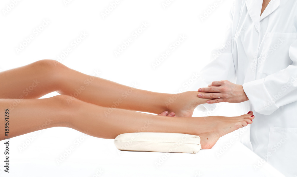 Beautiful woman having massage leg at spa salon Beautiful woman having massage leg at spa salon
