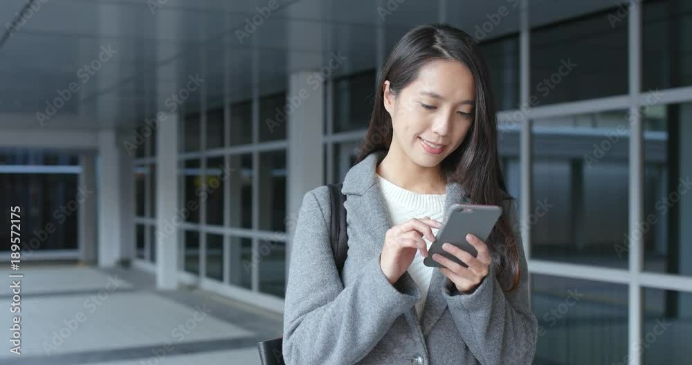 Asian Business woman using mobile phone at outdoor Asian Business woman using mobile phone at outdoor