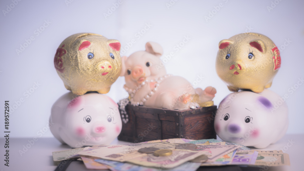 Mexican PESOS, South African RAND, Malaysia RINGKIT, Sveriges KRONOR Banknote and coins on wood plank, Piggy Bank, Money Saving Concept. Mexican PESOS, South African RAND, Malaysia RINGKIT, Sveriges KRONOR Banknote and coins on wood plank, Piggy Bank, Money Saving Concept.