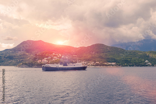 View on big ferry and greek island Kefalonia on sunset