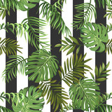 Seamless pattern with tropical palm leaves and vertical stripes