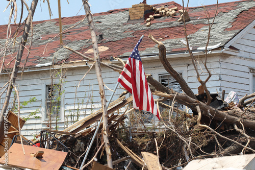 EF5 Tornado Damaged House Flying an American Flag as a Symbol of Resolve to Rebuild photo