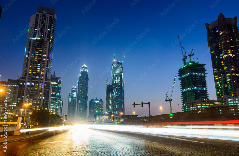 Traffic in Dubai, night scene with light trails