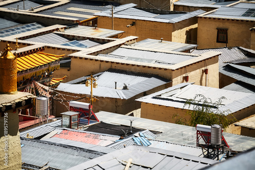 Aerial picture of roofs made or corrugated sheets, abstract urban background.