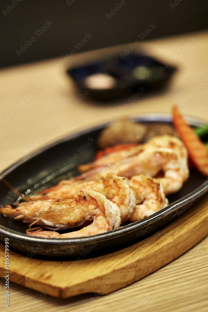 Japanese seafood. Fried spicy shrimps with herbs Japanese seafood. Fried spicy shrimps with herbs