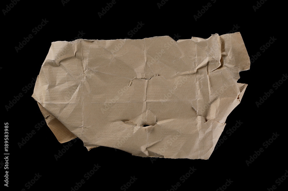 Crumpled and torn cardboard paper isolated on black background, clipping path Crumpled and torn cardboard paper isolated on black background, clipping path