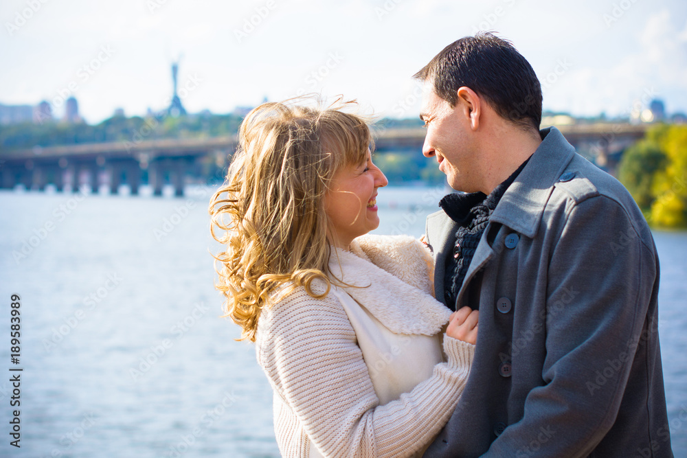 A middle-aged couple in love enjoys each other in embraces. The concept of relations without barriers, love and sincerity are all that is needed for happiness A middle-aged couple in love enjoys each other in embraces. The concept of relations without barriers, love and sincerity are all that is needed for happiness