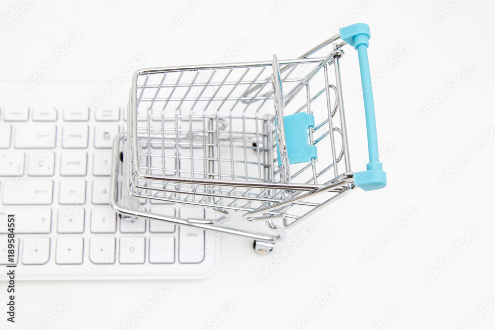 shopping cart with computer keyboard, online purchases