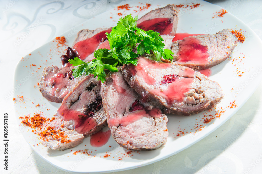 Slised meat meal with vegetables on white plate. Slised meat meal with vegetables on white plate.